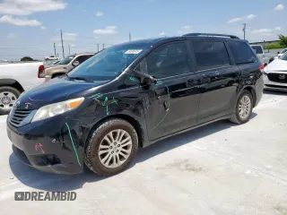 2014 Toyota Sienna XLE with VIN 5TDYK3DC9ES408939, listed as a Copart auction lot 59696345 with 224,524 mi miles and Salvage title. Bid and sale history available at DreamBid. Image 1.