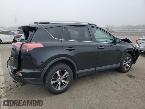 2018 Toyota RAV4 XLE with VIN 2T3RFREV8JW715099, listed as a Copart auction lot 51313485 with 140,107 mi miles and Salvage Title. Bid and sale history available at DreamBid. Image 3.