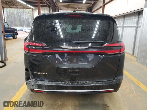 2023 Chrysler Pacifica Touring L with VIN 2C4RC1BG3PR582271, listed as a Copart auction lot 51644595 with 57,930 mi miles and Salvage title. Bid and sale history available at DreamBid. Image 6.