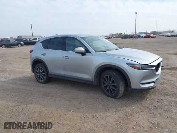 2017 Mazda CX-5 Grand Touring with VIN JM3KFBDL8H0227348, listed as a IAAI auction lot 41572377 with 124,908 mi miles. Bid and sale history available at carsss.com. Image 1.