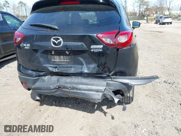2016 Mazda CX-5 Grand Touring with VIN JM3KE4DY8G0639570, listed as a IAAI auction lot 42098512 with 126,541 mi miles and . Bid and sale history available at carsss.com. Image 6.