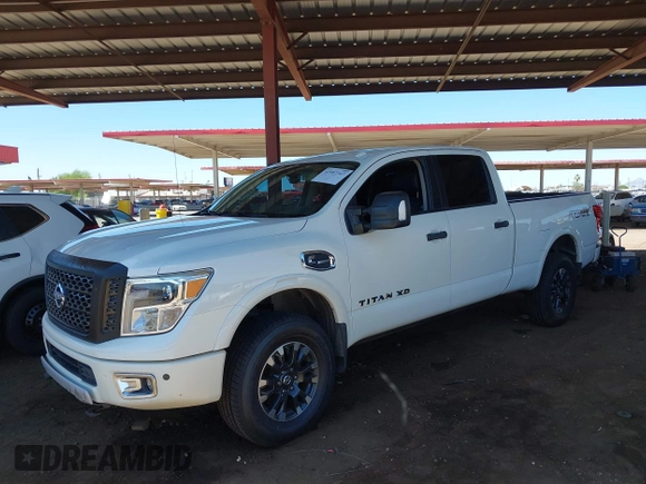 2019 Nissan Titan Pro-4X with VIN 1N6BA1F45KN533051, listed as a IAAI auction lot 42587343 with 134,768 mi miles and . Bid and sale history available at DreamBid. Image 2.