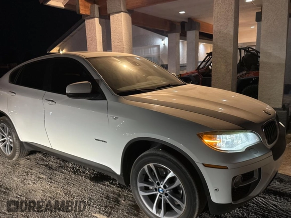 2014 BMW X6 xDrive35i with VIN 5UXFG2C58E0H09681, listed as a Copart auction lot 83922494 with 120,170 mi miles and Salvage Title. Bid and sale history available at carsss.com. Image 1.
