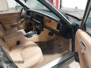 1985 Jaguar XJ with VIN SAJAV1347FC414864, listed as a IAAI auction lot 42118511 with 117,185 mi miles and . Bid and sale history available at DreamBid. Image 5.
