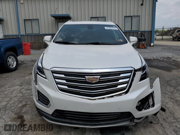 2020 Cadillac XT5 Premium Luxury FWD with VIN 1GYKNCRS5LZ229686, listed as a Copart auction lot 57391915 with 54,491 mi miles and Salvage title. Bid and sale history available at DreamBid. Image 5.