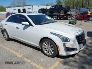 2015 Cadillac CTS Luxury AWD z VIN 1G6AX5SX5F0103725, wystawiony jako IAAI lot #42226485 z przebiegiem 112 437 mil mil oraz . Historia ofert i sprzedaży dostępna na DreamBid. Obrazek 1.
