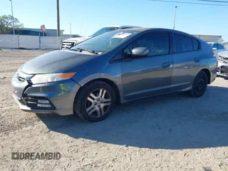 2012 Honda Insight LX with VIN JHMZE2H51CS003694, listed as a IAAI auction lot 41781384 with 154,685 mi miles and . Bid and sale history available at DreamBid. Image 2.