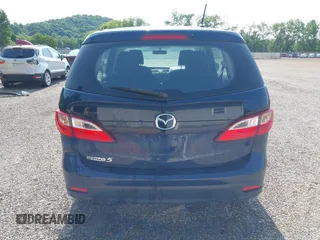 2015 Mazda 5 Sport z VIN JM1CW2BL9F0187973, wystawiony jako IAAI lot #42378711 z przebiegiem 97 543 mil mil oraz . Historia ofert i sprzedaży dostępna na DreamBid. Obrazek 16.