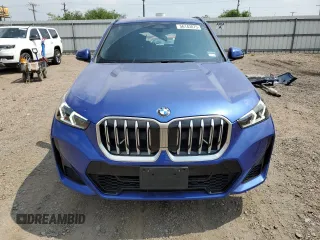 2024 BMW X1 xDrive28i with VIN WBX73EF06R5007063, listed as a Copart auction lot 56143075 with 2,947 mi miles and Salvage title. Bid and sale history available at DreamBid. Image 5.