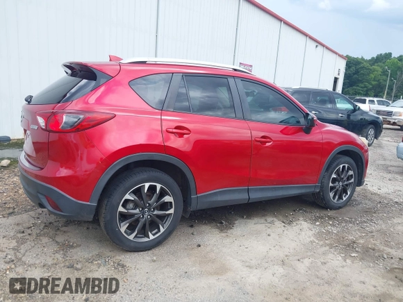 2016 Mazda CX-5 Grand Touring z VIN JM3KE2DY6G0693678, wystawiony jako IAAI lot #42443247 z przebiegiem 127 620 mil mil oraz . Historia ofert i sprzedaży dostępna na DreamBid. Obrazek 6.