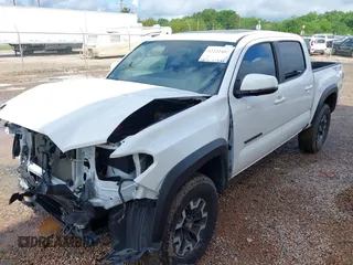 2023 Toyota Tacoma SR with VIN 3TMCZ5AN7PM639378, listed as a IAAI auction lot 42222407 with 38,172 mi miles and . Bid and sale history available at DreamBid. Image 2.