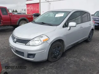 2009 Nissan Versa 1.8 SL with VIN 3N1BC13E19L500653, listed as a IAAI auction lot 41616544 with 138,554 mi miles. Bid and sale history available at carsss.com. Image 2.