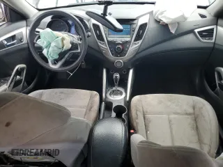 2014 Hyundai Veloster z VIN KMHTC6AD3EU198500, wystawiony jako Copart lot #56943915 z przebiegiem 118 173 mil mil oraz Tytuł czysty. Historia ofert i sprzedaży dostępna na DreamBid. Obrazek 8.