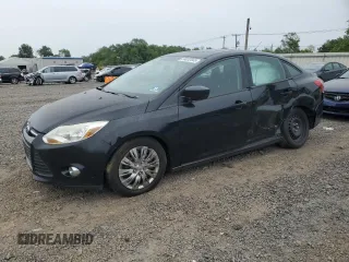 2012 Ford Focus SE with VIN 1FAHP3F23CL213185, listed as a Copart auction lot 58032845 with 115,888 mi miles and Salvage title. Bid and sale history available at DreamBid. Image 1.
