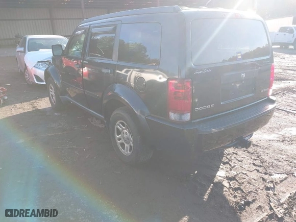 2009 Dodge Nitro SE with VIN 1D8GT28KX9W518412, listed as a IAAI auction lot 41458414 with 178,308 mi miles. Bid and sale history available at carsss.com. Image 3.