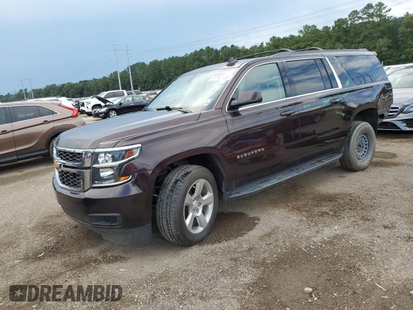 2020 Chevrolet Suburban LS z VIN 1GNSCGKC7LR218296, wystawiony jako Copart lot #61767105 z przebiegiem 118 405 mil mil oraz Szkoda całkowita • Salvage title. Historia ofert i sprzedaży dostępna na DreamBid. Obrazek 1.
