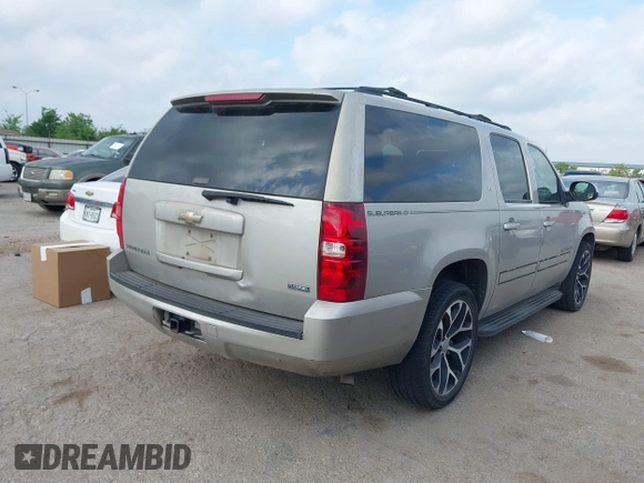 2009 Chevrolet Suburban LT w/2LT with VIN 1GNFC26039R234735, listed as a IAAI auction lot 42068617 with 263,534 mi miles. Bid and sale history available at carsss.com. Image 4.