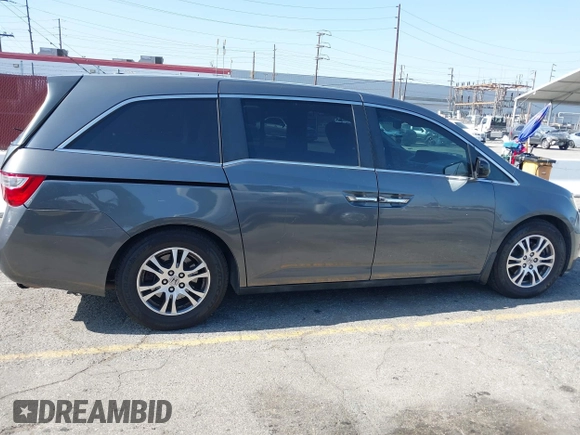 2011 Honda Odyssey EX-L with VIN 5FNRL5H64BB070836, listed as a IAAI auction lot 42520878 with 162,316 mi miles and . Bid and sale history available at DreamBid. Image 13.