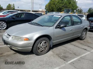 1997 Dodge Stratus z VIN 1B3EJ56H0VN679440, wystawiony jako Copart lot #71977454 z przebiegiem 83 367 mil mil oraz Tytuł czysty. Historia ofert i sprzedaży dostępna na DreamBid. Obrazek 1.