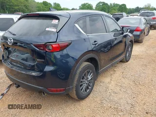 2020 Mazda CX-5 Touring with VIN JM3KFBCM9L0741535, listed as a IAAI auction lot 42101763 with 54,004 mi miles and . Bid and sale history available at DreamBid. Image 4.