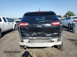 2014 Jeep Cherokee Latitude z VIN 1C4PJMCBXEW284645, wystawiony jako Copart lot #58838355 z przebiegiem 131 631 mil mil oraz Szkoda całkowita • Salvage title. Historia ofert i sprzedaży dostępna na DreamBid. Obrazek 6.