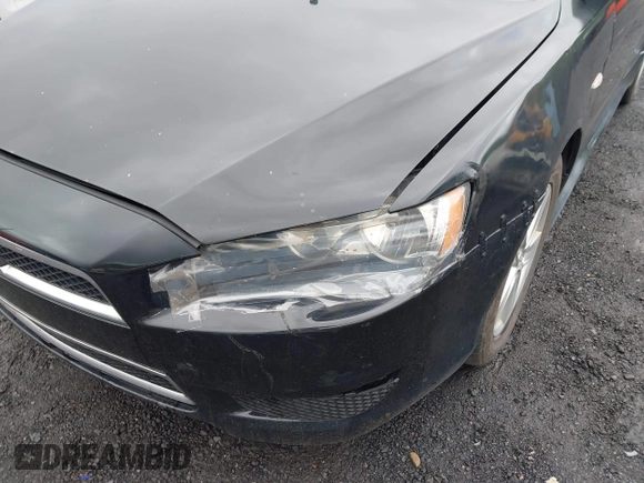 2014 Mitsubishi Lancer SE with VIN JA32V2FW5EU005615, listed as a IAAI auction lot 42204917 with 141,285 mi miles and . Bid and sale history available at carsss.com. Image 6.