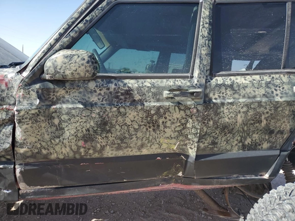 1999 Jeep Cherokee Sport with VIN 1J4FF68S6XL645028, listed as a Copart auction lot 48897255 with 218,552 mi miles and Salvage Title. Bid and sale history available at carsss.com. Image 7.