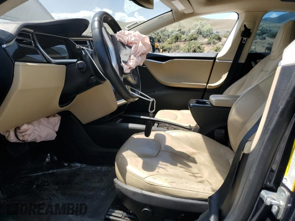 2014 Tesla Model S 60 with VIN 5YJSA1S12EFP29885, listed as a Copart auction lot 59769215 with Not provided miles and Salvage title. Bid and sale history available at DreamBid. Image 7.