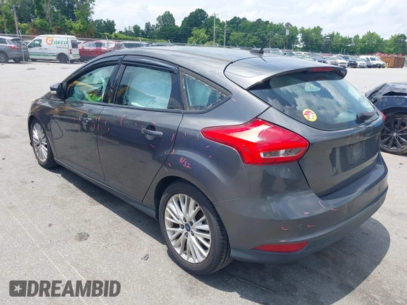 2016 Ford Focus Titanium with VIN 1FADP3N20GL275763, listed as a IAAI auction lot 42511959 with 124,891 mi miles and . Bid and sale history available at DreamBid. Image 3.