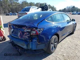 2022 Tesla Model 3 Long Range with VIN 5YJ3E1EB1NF257059, listed as a IAAI auction lot 41329318 with 30,652 mi miles and . Bid and sale history available at DreamBid. Image 4.