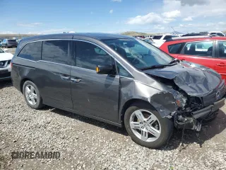 2012 Honda Odyssey Touring with VIN 5FNRL5H97CB070213, listed as a Copart auction lot 53558715 with 218,964 mi miles and Salvage title. Bid and sale history available at DreamBid. Image 4.
