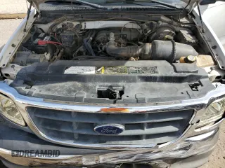 2003 Ford F-150 XL z VIN 1FTRX17233NB92067, wystawiony jako Copart lot #57986555 z przebiegiem 179 101 mil mil oraz Szkoda całkowita • Salvage title. Historia ofert i sprzedaży dostępna na DreamBid. Obrazek 11.