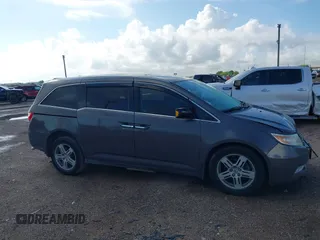 2011 Honda Odyssey Touring with VIN 5FNRL5H93BB104436, listed as a IAAI auction lot 40426003 with 93,342 mi miles and . Bid and sale history available at DreamBid. Image 13.