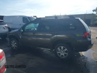 2011 Mitsubishi Endeavor LS with VIN 4A4JN2AS4BE030926, listed as a IAAI auction lot 41217100 with 154,340 mi miles. Bid and sale history available at carsss.com. Image 14.