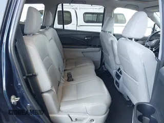 2019 Honda Pilot Touring 8-Passenger z VIN 5FNYF5H97KB013530, wystawiony jako IAAI lot #42403449 z przebiegiem 90 557 mil mil oraz . Historia ofert i sprzedaży dostępna na DreamBid. Obrazek 8.