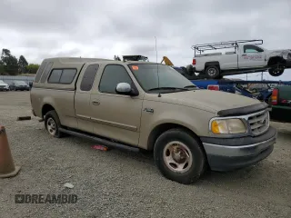 2000 Ford F-150 XL with VIN 1FTRX17L3YKB07018, listed as a Copart auction lot 66998714 with 0 mi miles and Salvage Title. Bid and sale history available at carsss.com. Image 4.