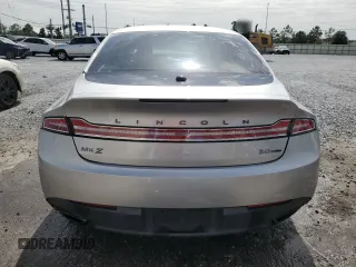 2014 Lincoln MKZ z VIN 3LN6L2G91ER831043, wystawiony jako Copart lot #63109715 z przebiegiem Nie podano mil oraz Szkoda całkowita • Salvage title. Historia ofert i sprzedaży dostępna na DreamBid. Obrazek 6.