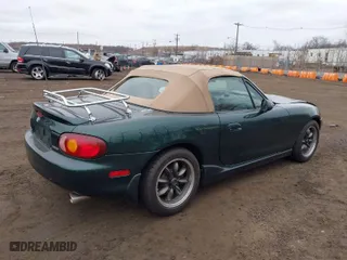 2000 Mazda MX-5 Miata with VIN JM1NB3536Y0150274, listed as a IAAI auction lot 41685970 with 128,492 mi miles. Bid and sale history available at carsss.com. Image 4.