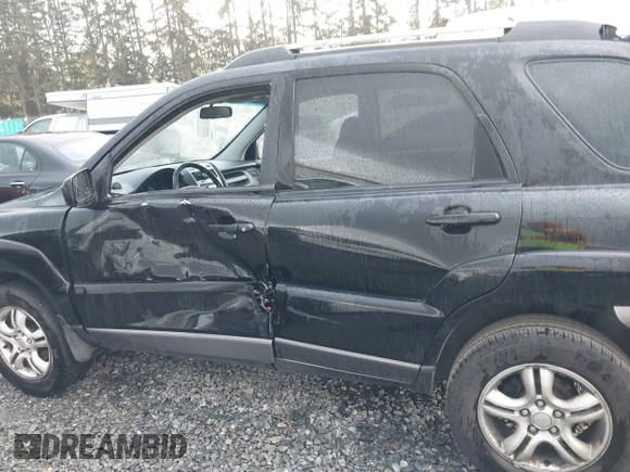 2005 Kia Sportage LX with VIN KNDJF723557054234, listed as a IAAI auction lot 40652851 with 220,215 mi miles and . Bid and sale history available at carsss.com. Image 14.