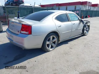 2009 Dodge Charger R/T with VIN 2B3LA53T89H610073, listed as a IAAI auction lot 41812611 with 135,364 mi miles. Bid and sale history available at carsss.com. Image 4.