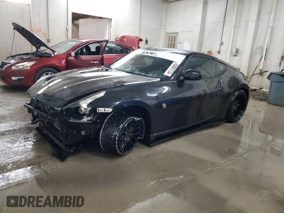 2009 Nissan 370Z z VIN JN1AZ44EX9M407193, wystawiony jako Copart lot #84891734 z przebiegiem 129 296 mil mil oraz Szkoda całkowita • Salvage title. Historia ofert i sprzedaży dostępna na DreamBid. Obrazek 1.