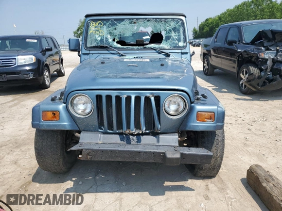 1999 Jeep Wrangler SE with VIN 1J4FY29P0XP422425, listed as a Copart auction lot 60513335 with Not provided miles and Clean title. Bid and sale history available at DreamBid. Image 5.