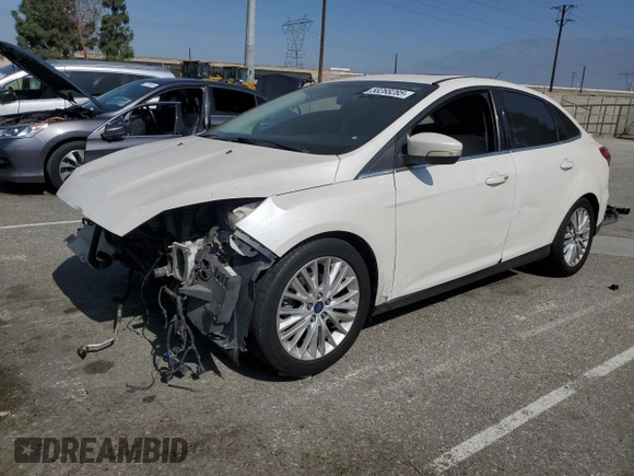 2017 Ford Focus Titanium with VIN 1FADP3J2XHL291606, listed as a Copart auction lot 58268285 with 153,272 mi miles and Salvage title. Bid and sale history available at DreamBid. Image 1.