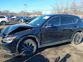 2017 Mazda CX-5 Grand Touring with VIN JM3KFBDL0H0104806, listed as a IAAI auction lot 41621964 with 60,728 mi miles. Bid and sale history available at carsss.com. Image 20.