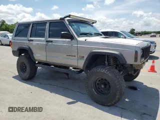 2000 Jeep Cherokee SE with VIN 1J4FF28SXYL140930, listed as a Copart auction lot 59191035 with 248,598 mi miles and Salvage title. Bid and sale history available at DreamBid. Image 4.