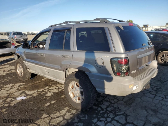 1999 Jeep Grand Cherokee Laredo with VIN 1J4GW58NXXC747537, listed as a Copart auction lot 87310234 with 0 mi miles and Salvage Title. Bid and sale history available at carsss.com. Image 2.