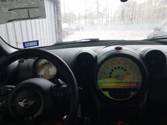 2014 MINI Countryman S with VIN WMWZC5C53EWP40677, listed as a IAAI auction lot 41473281 with 108,616 mi miles and . Bid and sale history available at DreamBid. Image 15.