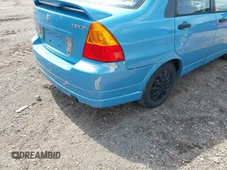 2005 Suzuki Aerio S z VIN JS2RA62SX55256992, wystawiony jako IAAI lot #42294720 z przebiegiem 141 626 mil mil oraz . Historia ofert i sprzedaży dostępna na DreamBid. Obrazek 6.