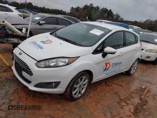 2016 Ford Fiesta SE with VIN 3FADP4EJ2GM157810, listed as a IAAI auction lot 41011326 with 214,609 mi miles. Bid and sale history available at carsss.com. Image 2.