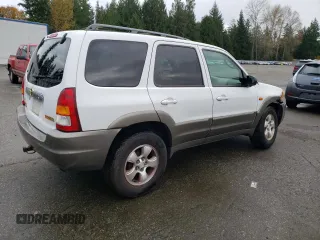 2001 Mazda Tribute LX with VIN 4F2CU08101KM11452, listed as a Copart auction lot 76796064 with 175,584 mi miles and Salvage Title. Bid and sale history available at DreamBid. Image 3.